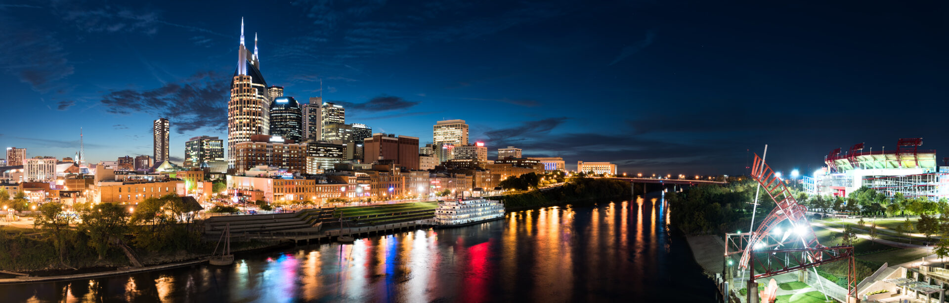 Blue Nashville Skyline at Dusk with Riverboat and Nissan Stadium